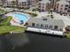 Community pool, clubhouse, and deck overlooking a lake at 1403 Gondola Park Dr # 1403Bd, Venice, FL 34292