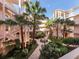 Aerial view of a community courtyard with lush landscaping and a central fountain at 1403 Gondola Park Dr # 1403Bd, Venice, FL 34292