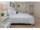 Spacious main bedroom with a king-size bed and ensuite bathroom access at 1403 Gondola Park Dr # 1403Bd, Venice, FL 34292