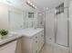 Updated bathroom with a walk-in shower and modern vanity at 1403 Gondola Park Dr # 1403Bd, Venice, FL 34292