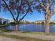 Scenic lake view with walking path and lush trees at 1403 Gondola Park Dr # 1403Bd, Venice, FL 34292