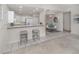 Modern kitchen with white cabinets and breakfast bar at 1403 Gondola Park Dr # 1403Bd, Venice, FL 34292