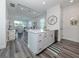 Open concept kitchen with island and stainless steel appliances at 113 Clifton Way, Venice, FL 34292