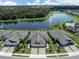 Aerial view of the house in a beautiful community with a lake and fountain in the background at 12586 Oak Hill Way, Parrish, FL 34219