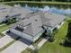 Aerial view of an immaculate home featuring manicured landscaping and a three-car garage at 12586 Oak Hill Way, Parrish, FL 34219