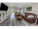 Inviting living room featuring a water view, stylish decor, and modern finishes at 12586 Oak Hill Way, Parrish, FL 34219