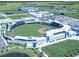 Aerial view of a baseball stadium with surrounding fields and parking at 381 Marsh Creek Rd, Venice, FL 34292