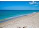 Scenic view of a tranquil beach with clear blue water at 5650 Mashie Cir, North Port, FL 34287