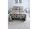 Spacious bedroom with neutral carpeting and bedding at 5650 Mashie Cir, North Port, FL 34287