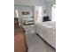 Main bedroom with mirrored closet doors and ensuite bathroom at 5650 Mashie Cir, North Port, FL 34287
