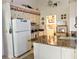 Updated kitchen with granite countertops and white appliances at 5650 Mashie Cir, North Port, FL 34287