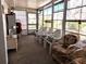 Spacious screened porch with multiple chairs and storage at 5650 Mashie Cir, North Port, FL 34287
