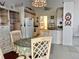Bright dining area with a round table and four chairs at 5650 Mashie Cir, North Port, FL 34287
