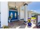 Elegant entryway with double blue doors and a stone walkway at 6780 Pan American Blvd, North Port, FL 34287