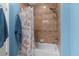 Simple bathroom with shower/tub combo and seashell decor at 110 Palazzo Ct, North Venice, FL 34275