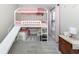 Charming bedroom with a playful, pink bunk bed and slide at 12586 Oak Hill Way, Parrish, FL 34219