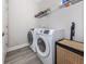 Convenient laundry room with washer, dryer, and shelving at 12586 Oak Hill Way, Parrish, FL 34219