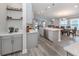 Open concept kitchen with island and stainless steel appliances at 12586 Oak Hill Way, Parrish, FL 34219