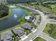 Aerial view of community with pool and lake at 12586 Oak Hill Way, Parrish, FL 34219