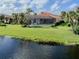 Home with screened patio backing up to a lake at 126 Cipriani Way, North Venice, FL 34275