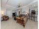 Bright and airy living room with ample seating and access to other rooms at 126 Cipriani Way, North Venice, FL 34275