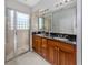 Bathroom boasts double sinks, granite countertop, and shower at 126 Cipriani Way, North Venice, FL 34275