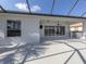 Outdoor patio with built-in grill and pool view at 126 Cipriani Way, North Venice, FL 34275