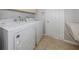 Bright laundry room with Whirlpool washer and dryer at 126 Cipriani Way, North Venice, FL 34275