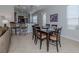Casual dining area with table and chairs, adjacent to the kitchen at 126 Cipriani Way, North Venice, FL 34275