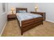 Bedroom with full bed and wood dresser at 126 Cipriani Way, North Venice, FL 34275
