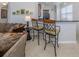 Kitchen island with seating for two, offering a casual dining option at 126 Cipriani Way, North Venice, FL 34275