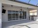 Outdoor patio with built-in grill and pool view at 126 Cipriani Way, North Venice, FL 34275