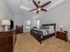Spacious main bedroom with large bed, dresser, and view at 126 Cipriani Way, North Venice, FL 34275