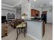 Modern kitchen with granite countertops and dark wood cabinets at 126 Cipriani Way, North Venice, FL 34275