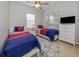 Bedroom with twin beds, dresser, and window at 126 Cipriani Way, North Venice, FL 34275
