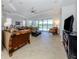Spacious living room with access to pool and patio at 126 Cipriani Way, North Venice, FL 34275