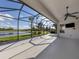 Large screened patio overlooking a lake at 126 Cipriani Way, North Venice, FL 34275
