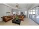 Spacious living room featuring comfortable sofas and a view to the kitchen at 126 Cipriani Way, North Venice, FL 34275