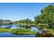 Scenic pond reflecting surrounding homes and trees at 4195 Fairway Pl, North Port, FL 34287