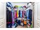 Large walk-in closet with ample hanging and shelving space at 4195 Fairway Pl, North Port, FL 34287