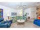 Comfortable living room with a large sectional sofa and a view to the kitchen at 4195 Fairway Pl, North Port, FL 34287