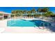 Inviting community pool with ample seating and shade at 4195 Fairway Pl, North Port, FL 34287