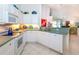 White kitchen features stainless steel appliances and ample counter space at 4195 Fairway Pl, North Port, FL 34287