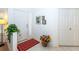 Bright and airy entryway with tile floors and access to other rooms at 4195 Fairway Pl, North Port, FL 34287