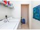 Laundry room with washer, dryer, and storage at 4195 Fairway Pl, North Port, FL 34287