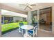 Screened porch with view of backyard and living room at 4195 Fairway Pl, North Port, FL 34287