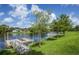 Community dock with a ramp providing lake access at 4195 Fairway Pl, North Port, FL 34287