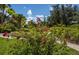 Lush landscaping with vibrant flowering plants at 4195 Fairway Pl, North Port, FL 34287