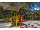 Modern playground with shade structures at 4195 Fairway Pl, North Port, FL 34287