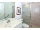 Clean bathroom with a shower, toilet, and vanity at 4195 Fairway Pl, North Port, FL 34287